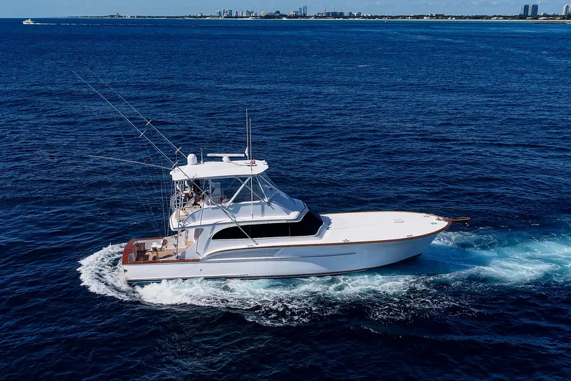 Slide: The Image of 1998 Buddy Davis 58 Sportfisherman cruising on open ocean waters. - 38