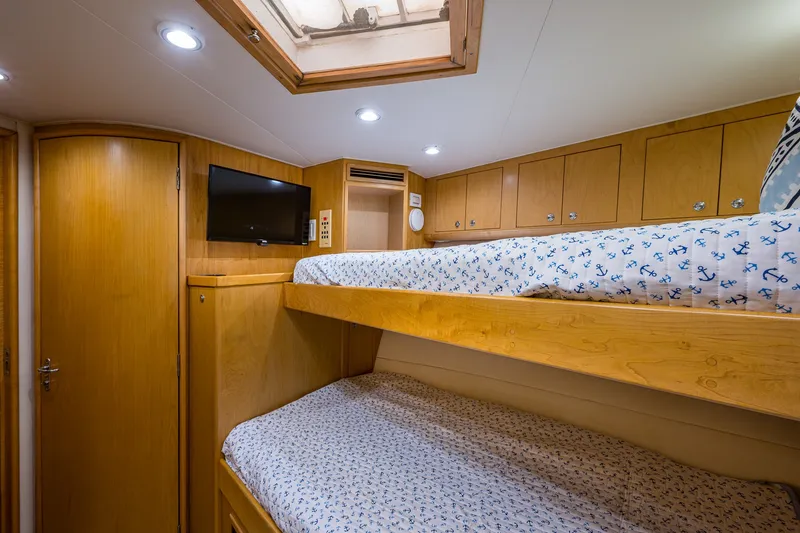 Slide: The Image of Cozy cabin interior of 1998 Buddy Davis 58 Sportfisherman with bunk beds and TV. - 19