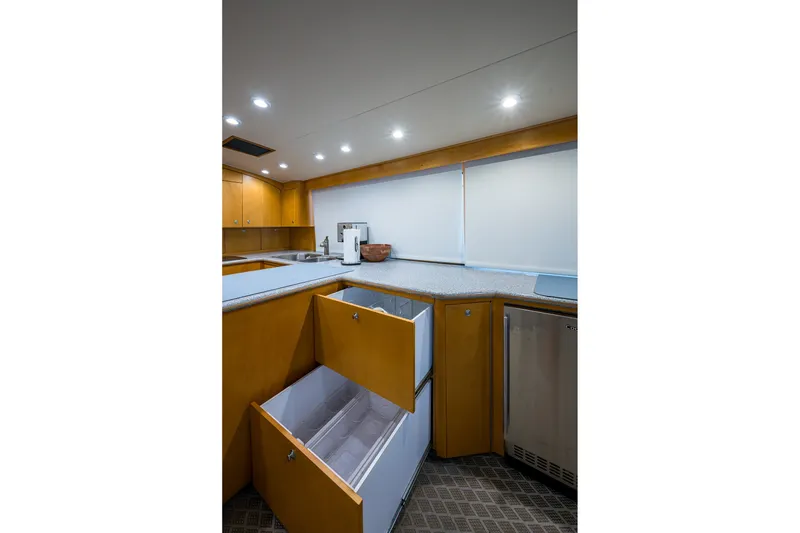 Slide: The Image of Interior of 1998 Buddy Davis 58 Sportfisherman yacht kitchen with open cabinets. - 17