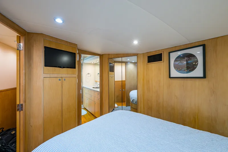 Slide: The Image of Interior cabin of 1998 Buddy Davis 58 Sportfisherman with wood paneling and modern amenities. - 26