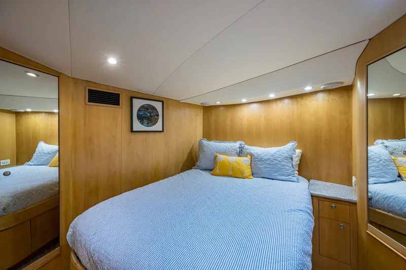 Slide: The Image of Cozy cabin interior of 1998 Buddy Davis 58 Sportfisherman with wood paneling and soft lighting. - 25