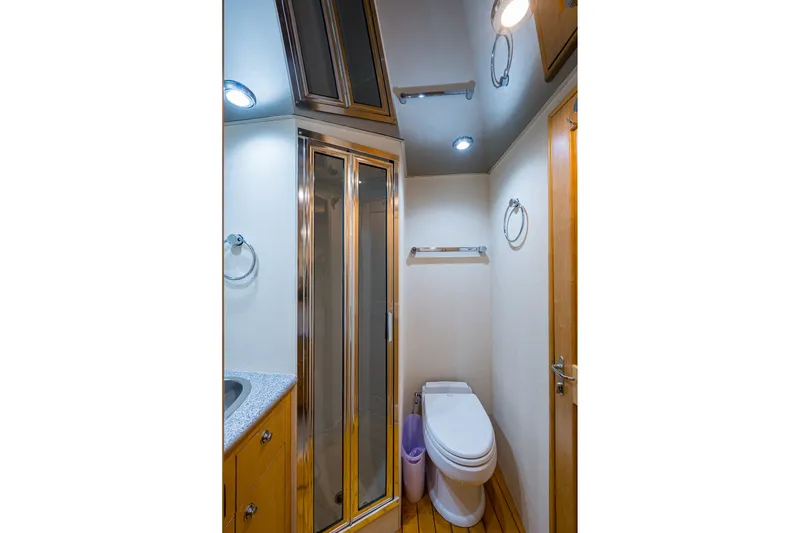 Slide: The Image of Luxurious bathroom in 1998 Buddy Davis 58 Sportfisherman yacht, featuring modern fixtures and elegant design. - 24