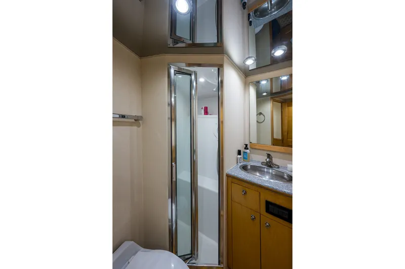 Slide: The Image of Bathroom interior of 1998 Buddy Davis 58 Sportfisherman yacht, featuring shower and sink. - 21