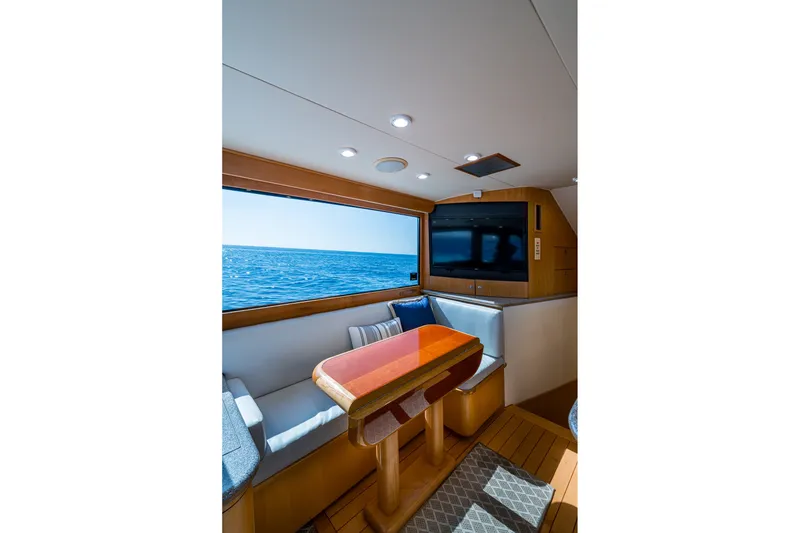 Slide: The Image of Interior of 1998 Buddy Davis 58 Sportfisherman with ocean view, dining area, and TV. - 15