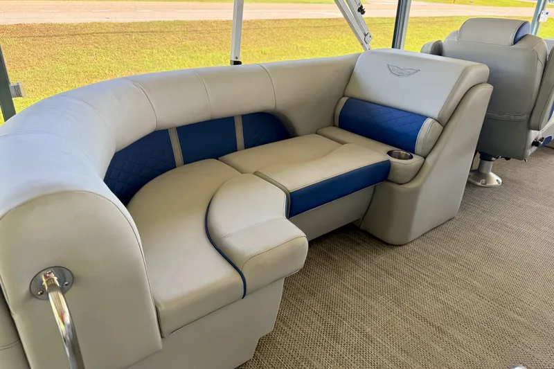 Slide: The Image of 2024 Bennington L22 boat interior with luxurious seating and cup holder. - 10