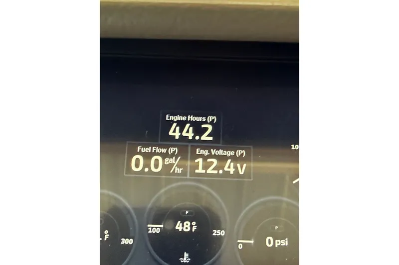 Slide: The Image of Dashboard display of a 2024 Bennington L22 showing engine hours and voltage. - 15
