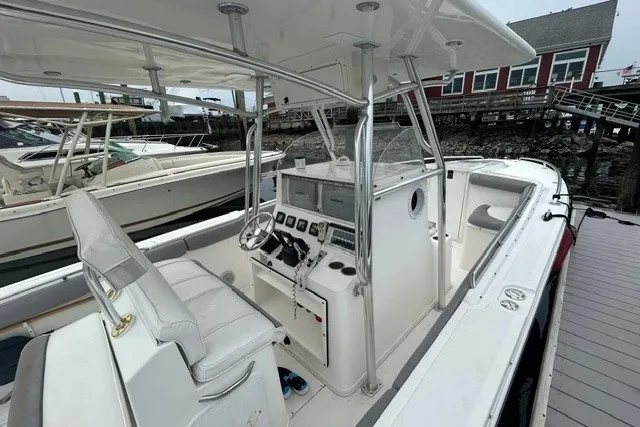 Slide: The Image of 2008 Jefferson Marlago 35 boat with sleek white interior and modern control panel at dock. - 7