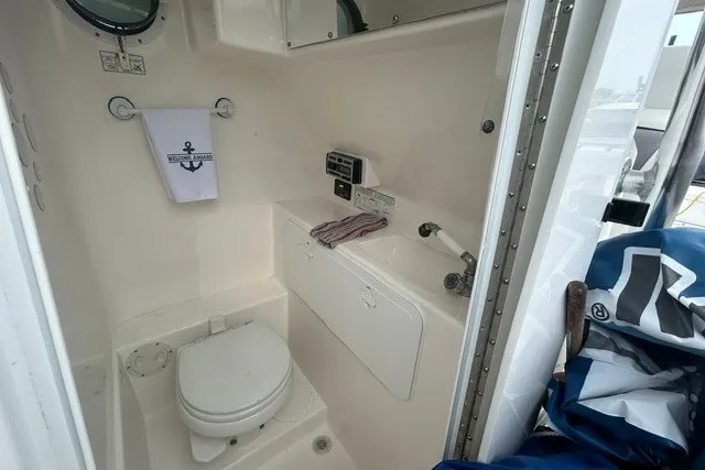 Slide: The Image of Compact bathroom in a 2008 Jefferson Marlago 35 boat, featuring a toilet and sink. - 11