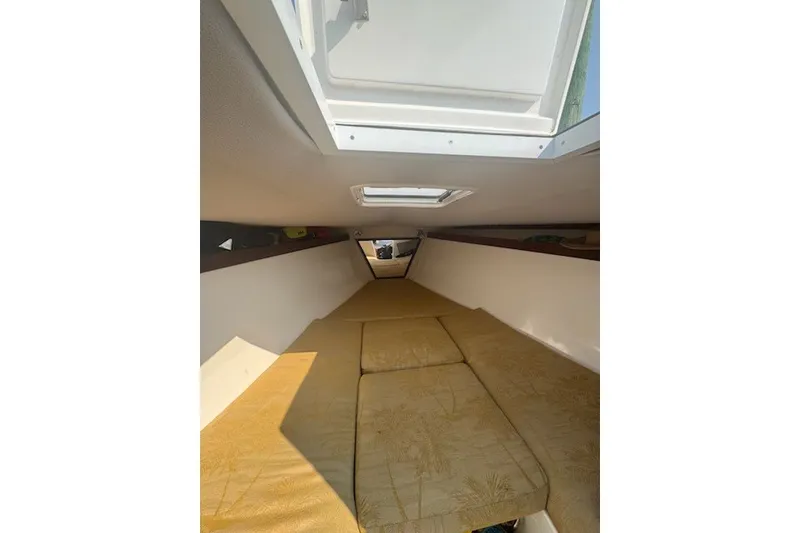 Slide: The Image of Interior cabin of a 2008 Jefferson Marlago 35 boat with beige cushions. - 10