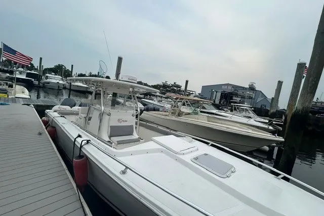 Slide: The Image of 2008 Jefferson Marlago 35 boat docked at a marina with other vessels. - 3