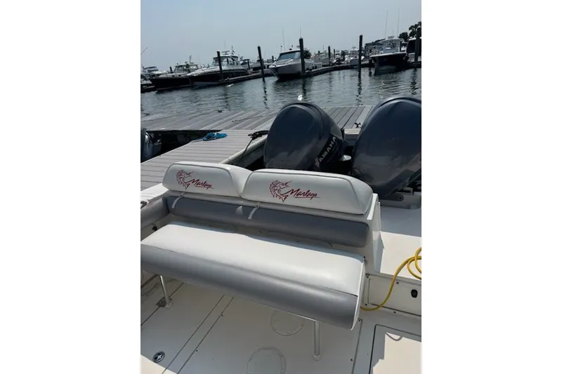 Slide: The Image of 2008 Jefferson Marlago 35 boat at dock with twin engines and branded seating. - 8
