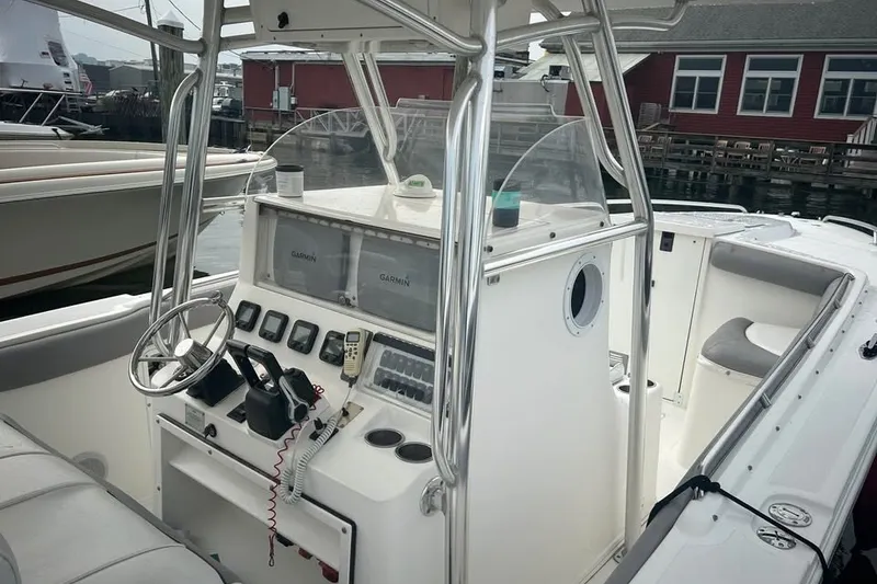 Slide: The Image of 2008 Jefferson Marlago 35 boat cockpit with steering wheel and navigation equipment. - 4