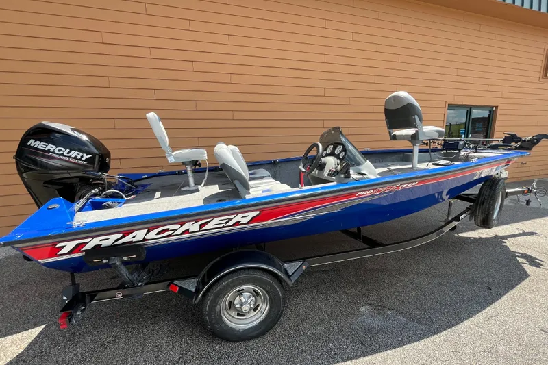 The Image of 2016 Tracker Pro Team 175 TF fishing boat with Mercury engine, parked outdoors. - 0