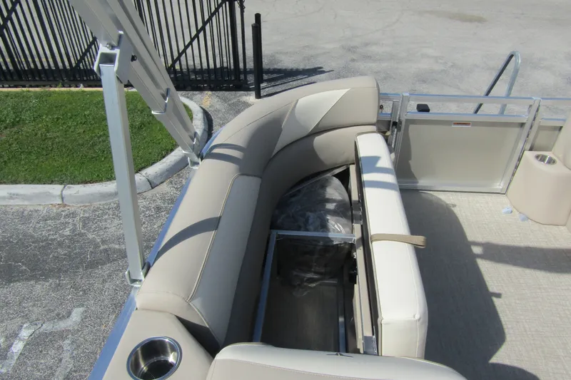 Slide: The Image of 2026 Tahoe Pontoon Sport 85 Rear Fish 21 with beige seating and storage compartment. - 13
