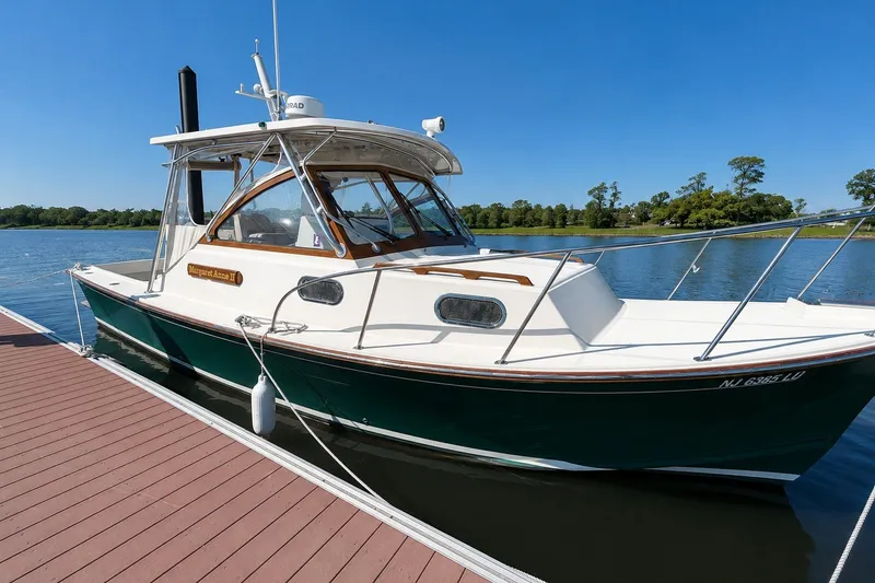 The Image of 2015 Fortier 30 boat docked on a sunny day by the water. - 0