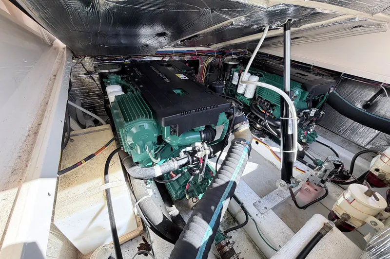 Slide: The Image of Engine room of a 2015 Fortier 30 boat, featuring dual Volvo Penta engines. - 18