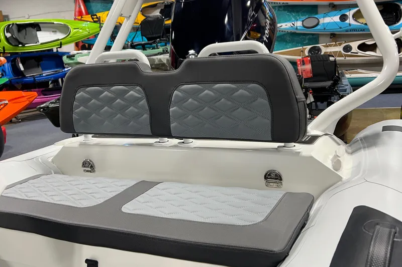 Slide: The Image of 2025 Highfield Sport 420 boat interior with gray cushioned seating. - 12