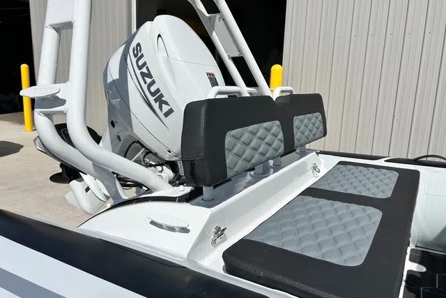Slide: The Image of 2026 Highfield Sport 420 boat with Suzuki engine, featuring quilted seating and sleek design. - 14
