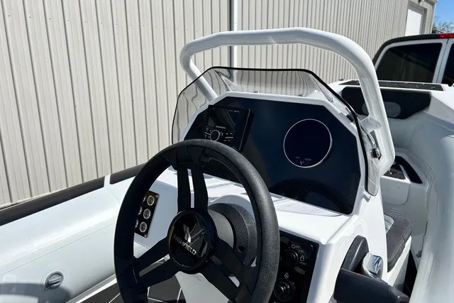 Slide: The Image of 2026 Highfield Sport 420 boat dashboard with steering wheel and control panel. - 15