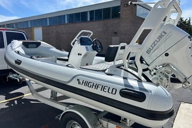 Slide: The Image of 2026 Highfield Sport 420 inflatable boat with Suzuki engine on trailer. - 1