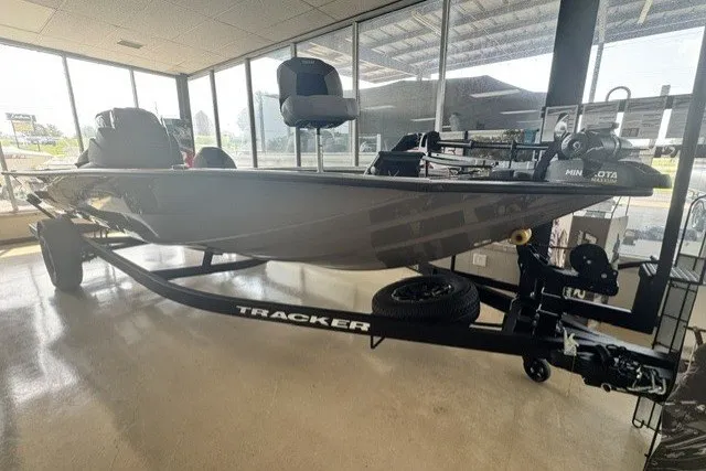 The Image of 2027 Tracker Pro Team 195 Tournament Edition boat displayed indoors on a trailer. - 1