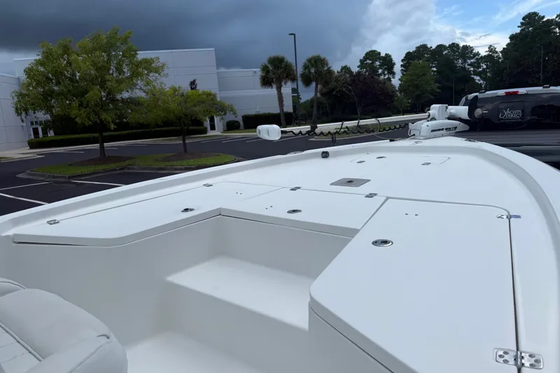Slide: The Image of 2015 Sea Hunt BX22 Pro boat in parking lot, cloudy sky background. - 15