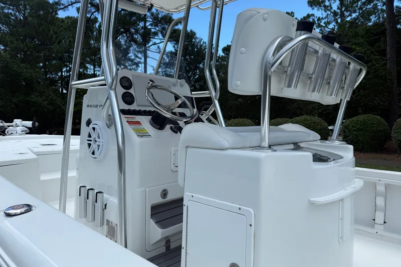 Slide: The Image of 2015 Sea Hunt BX22 Pro boat console with steering wheel and seating. - 17