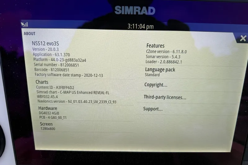 Slide: The Image of Simrad NSS12 evo3S display showing software and hardware details on a Sea Hunt BX22 Pro. - 32