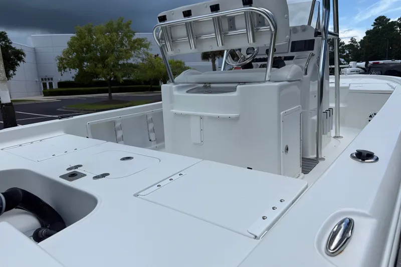 Slide: The Image of 2015 Sea Hunt BX22 Pro boat interior with seating and storage compartments. - 16
