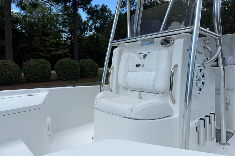 Slide: The Image of 2015 Sea Hunt BX22 Pro boat interior with white seating and stainless steel details. - 23