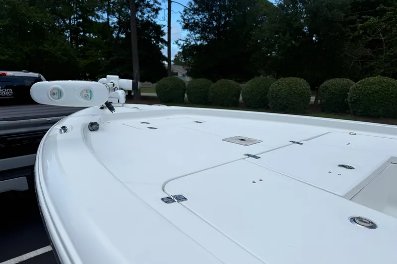 Slide: The Image of 2015 Sea Hunt BX22 Pro boat deck with storage compartments and trolling motor. - 21