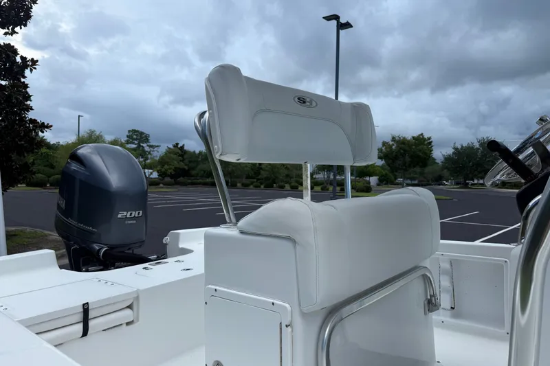 Slide: The Image of 2015 Sea Hunt BX22 Pro boat with Yamaha 200 engine in parking lot. - 14