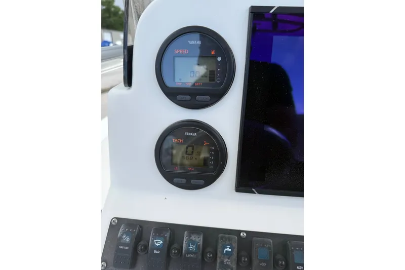 Slide: The Image of 2015 Sea Hunt BX22 Pro dashboard with Yamaha speed and tachometer gauges. - 29