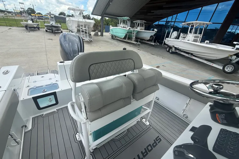 Slide: The Image of 2024 Sportsman Heritage 231 Center Console boat interior with helm and seating. - 18