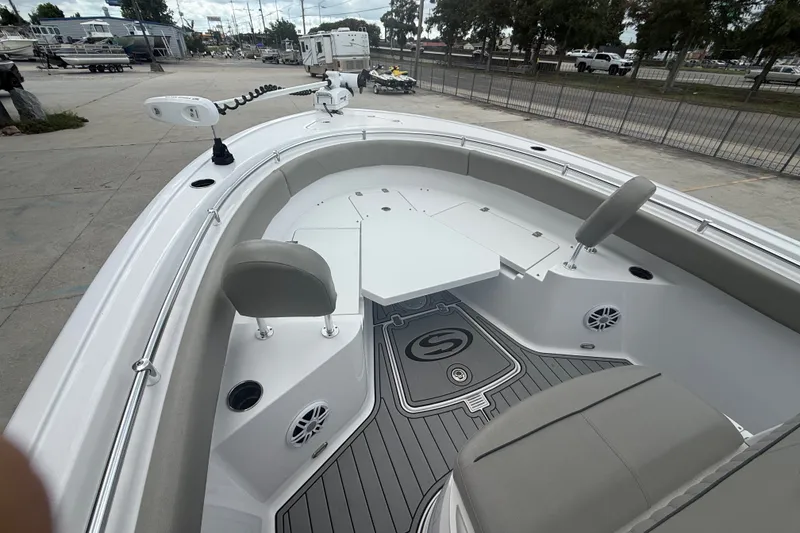 Slide: The Image of 2024 Sportsman Heritage 231 Center Console boat interior with seating and deck details. - 14