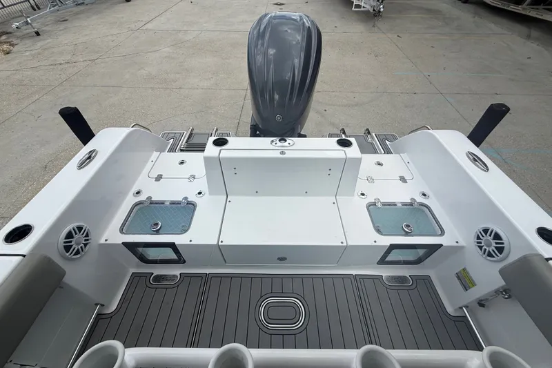 Slide: The Image of 2024 Sportsman Heritage 231 Center Console boat interior with dual livewells and sleek design. - 17