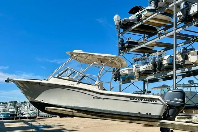 The Image of 2015 Grady-White Freedom 255 boat on dry dock, with Yamaha outboard motor. - 0