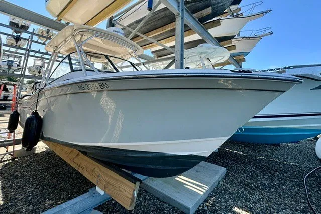 Slide: The Image of 2015 Grady-White Freedom 255 boat in dry storage, side view. - 2