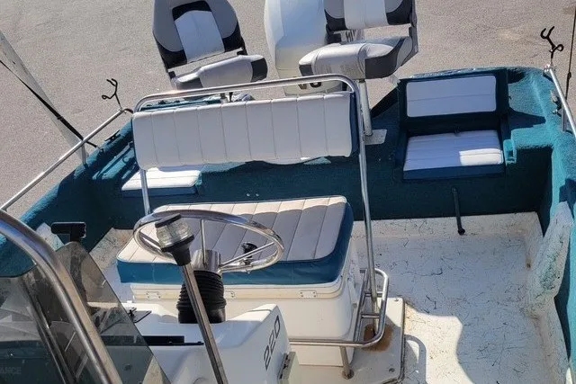 Slide: The Image of 1999 ProMaster 220 Bay boat interior with seating and steering wheel. - 6