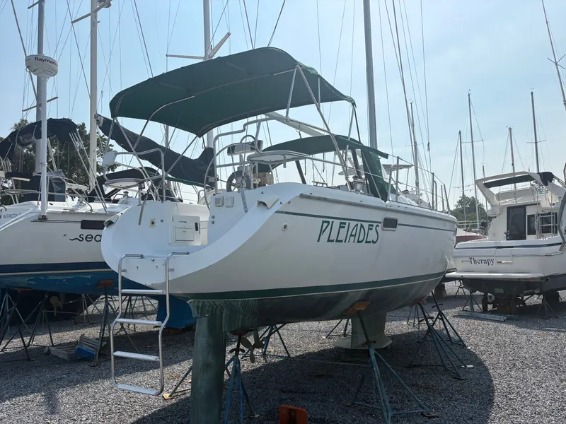 The Image of A 1997 Catalina 36 is on a dry dock, surrounded by other boats. - 0