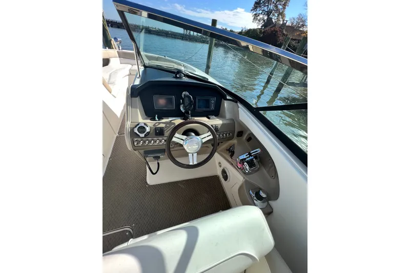 Slide: The Image of Cockpit view of 2013 Sea Ray 300 SLX boat with steering wheel and controls. - 5