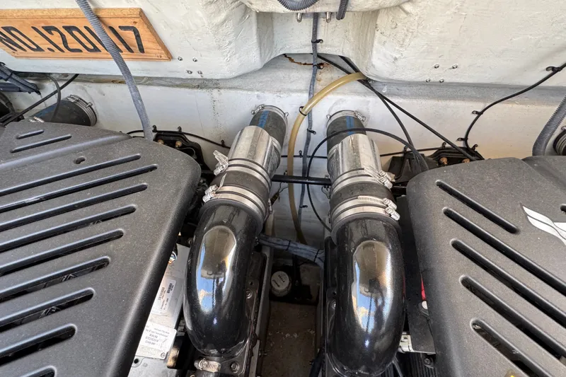 Slide: The Image of Engine compartment of a 2008 Envision 3600 Legacy ESP boat, showcasing dual engines and components. - 28