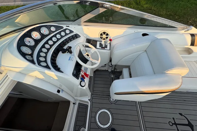 Slide: The Image of Cockpit of 2008 Envision 3600 Legacy ESP boat with white seating and instrument panel. - 12
