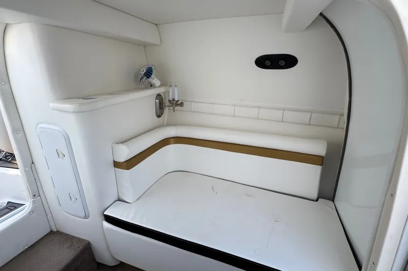 Slide: The Image of Interior of 2008 Envision 3600 Legacy ESP boat with white seating and compact design. - 20