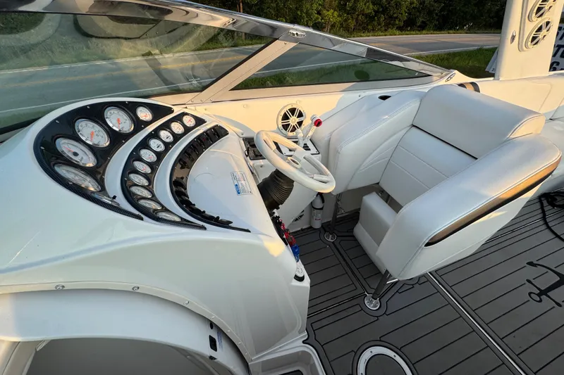 Slide: The Image of Cockpit of 2008 Envision 3600 Legacy ESP boat with white seating and instrument panel. - 14