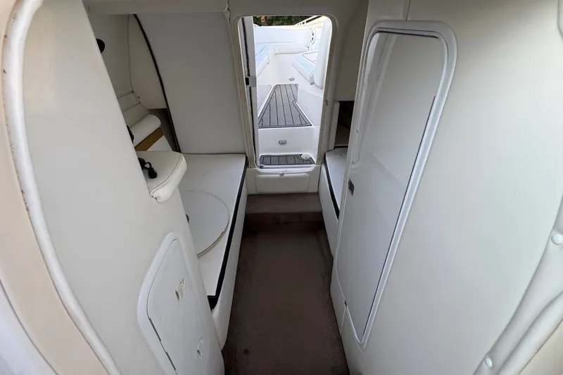 Slide: The Image of Interior view of 2008 Envision 3600 Legacy ESP boat cabin with white seating. - 19