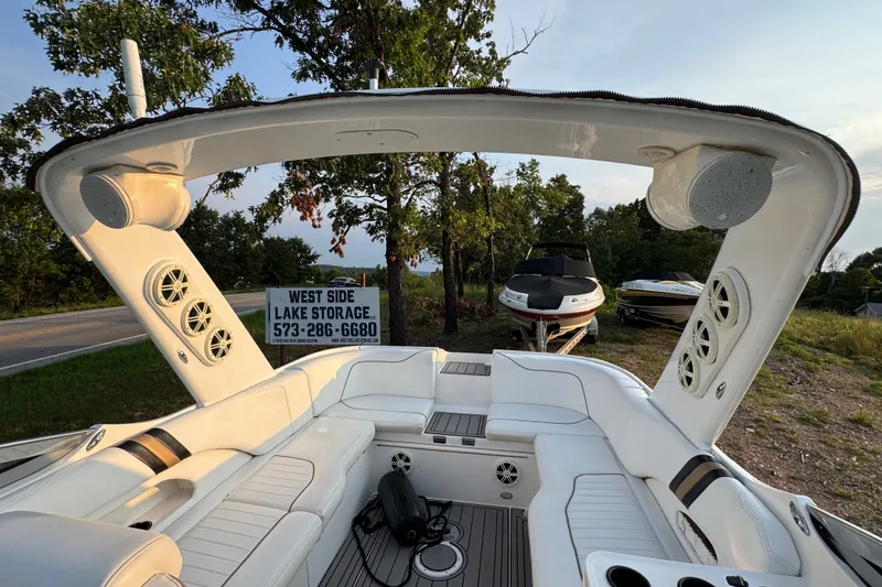 Slide: The Image of Interior of 2008 Envision 3600 Legacy ESP boat with white seating and speakers. - 18