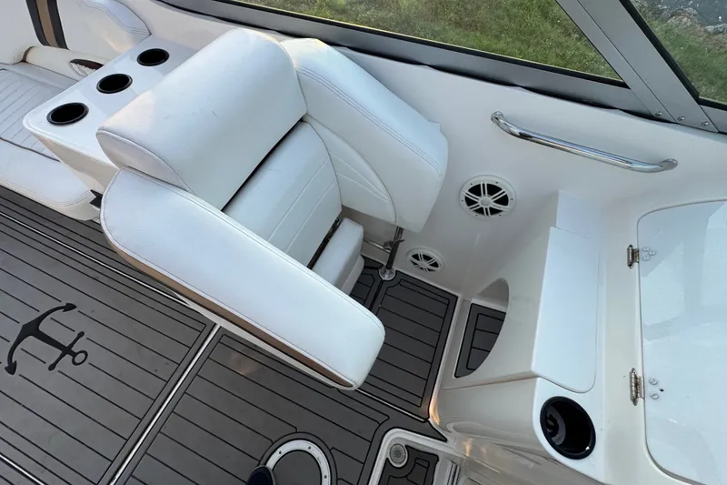 Slide: The Image of Interior of 2008 Envision 3600 Legacy ESP boat with white seating and cup holders. - 17