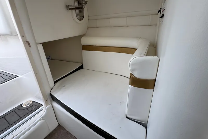 Slide: The Image of Interior seating area of 2008 Envision 3600 Legacy ESP boat, featuring white and gold upholstery. - 21