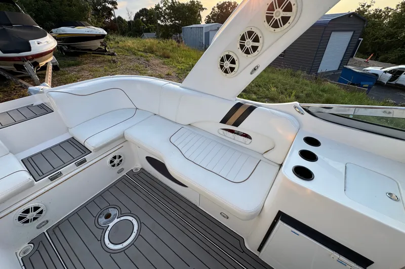 Slide: The Image of Interior of 2008 Envision 3600 Legacy ESP boat with white seating and speakers. - 10